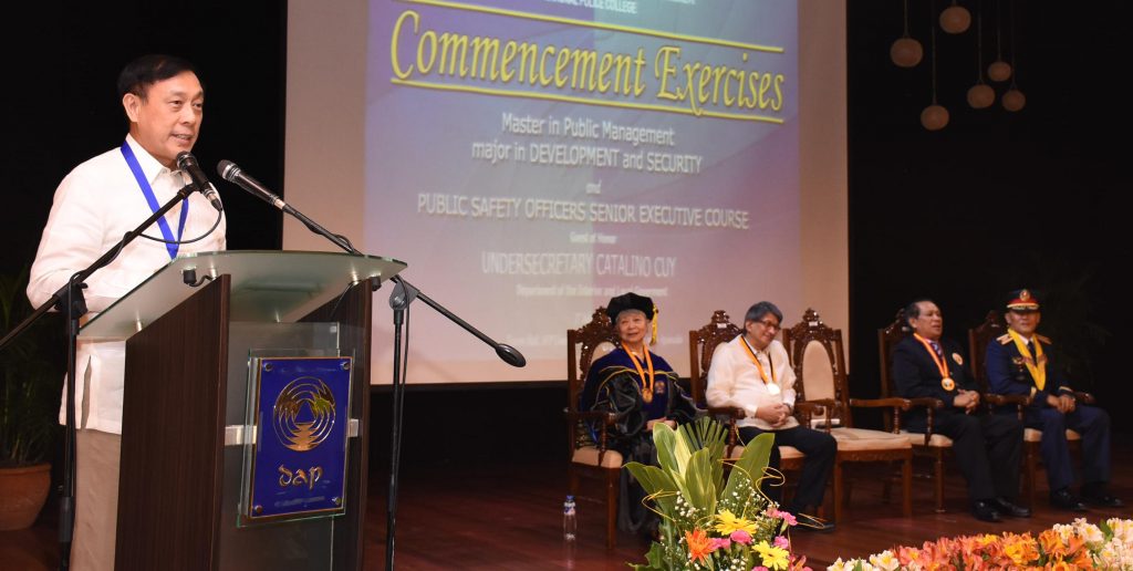DILG Undersecretary Catalino Cuy tells the first batch of graduates of the Master in Public Management-Development and Security to embrace the challenge of effecting change. (Photo by Ped Garcia) 